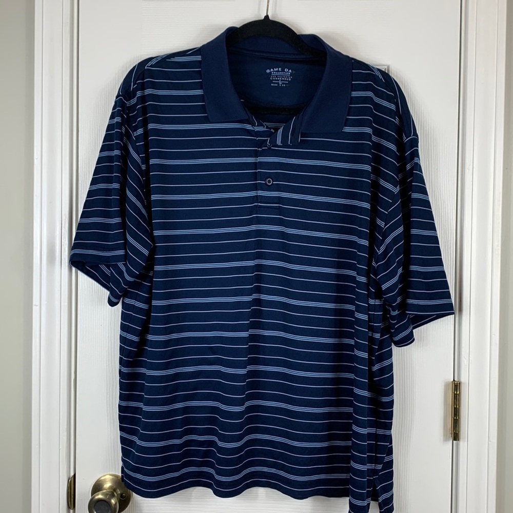 Game Day navy blue with light blue stripes. Short sleeved polo shirt size large.